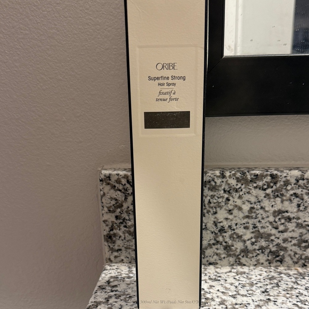 Oribe Superfine Strong Hair Spray in Cream and Black